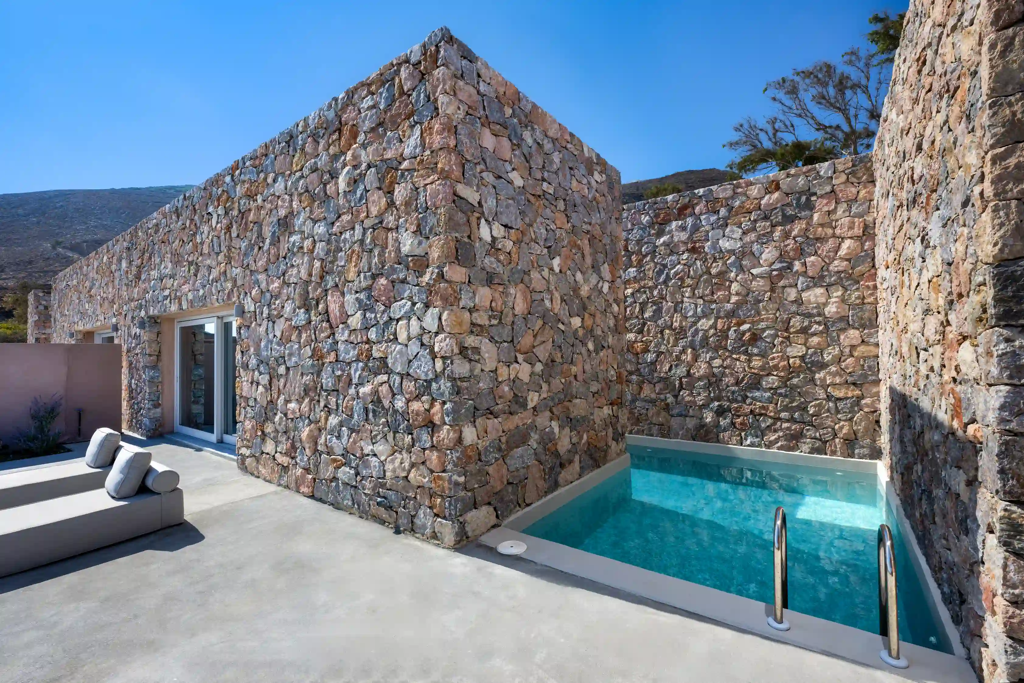 Felicity Cave Villas Santorini — stone-built hillside villa with private pool