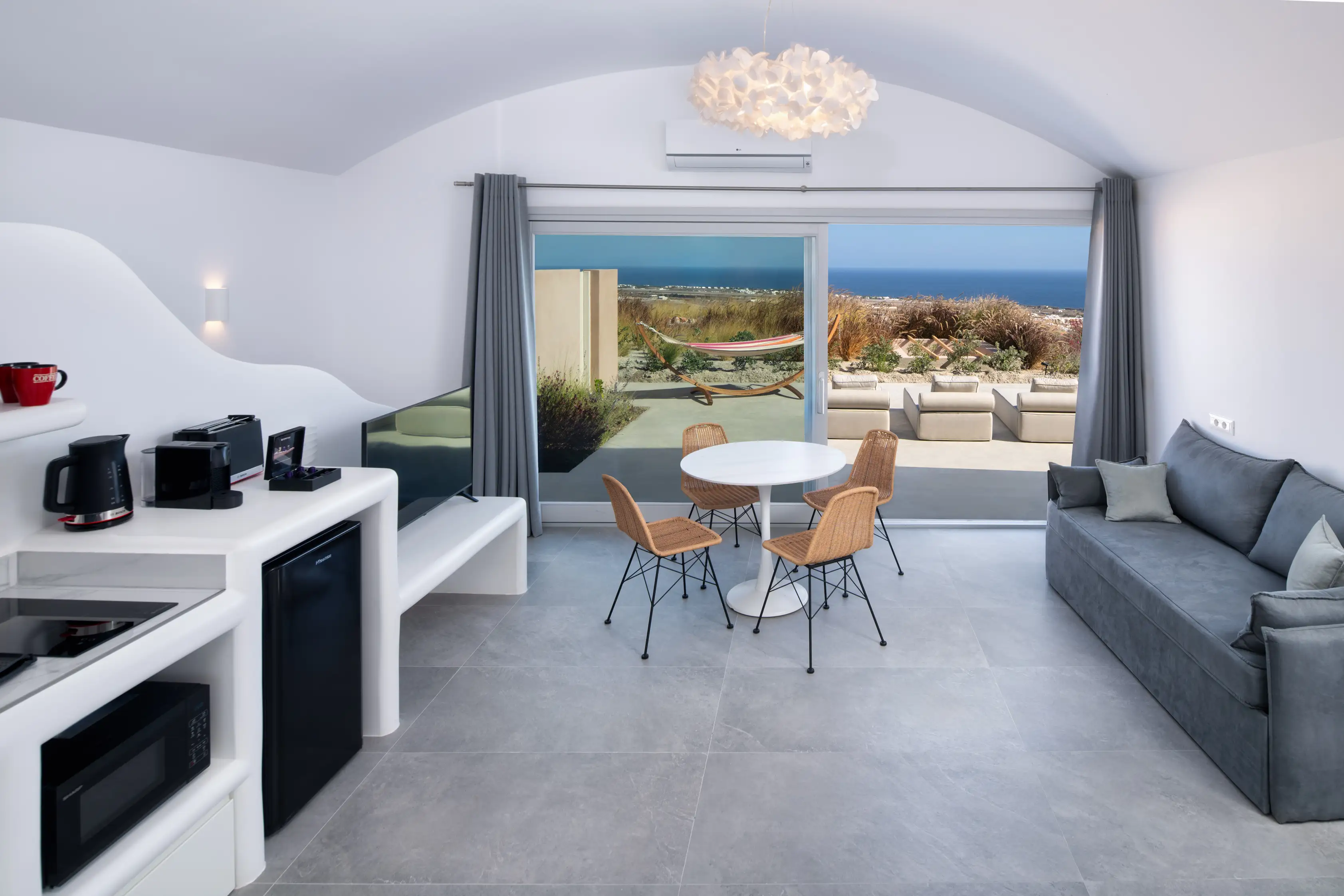 Deluxe Gaia Cave Villa kitchen and dining area - Modern amenities with panoramic sea views