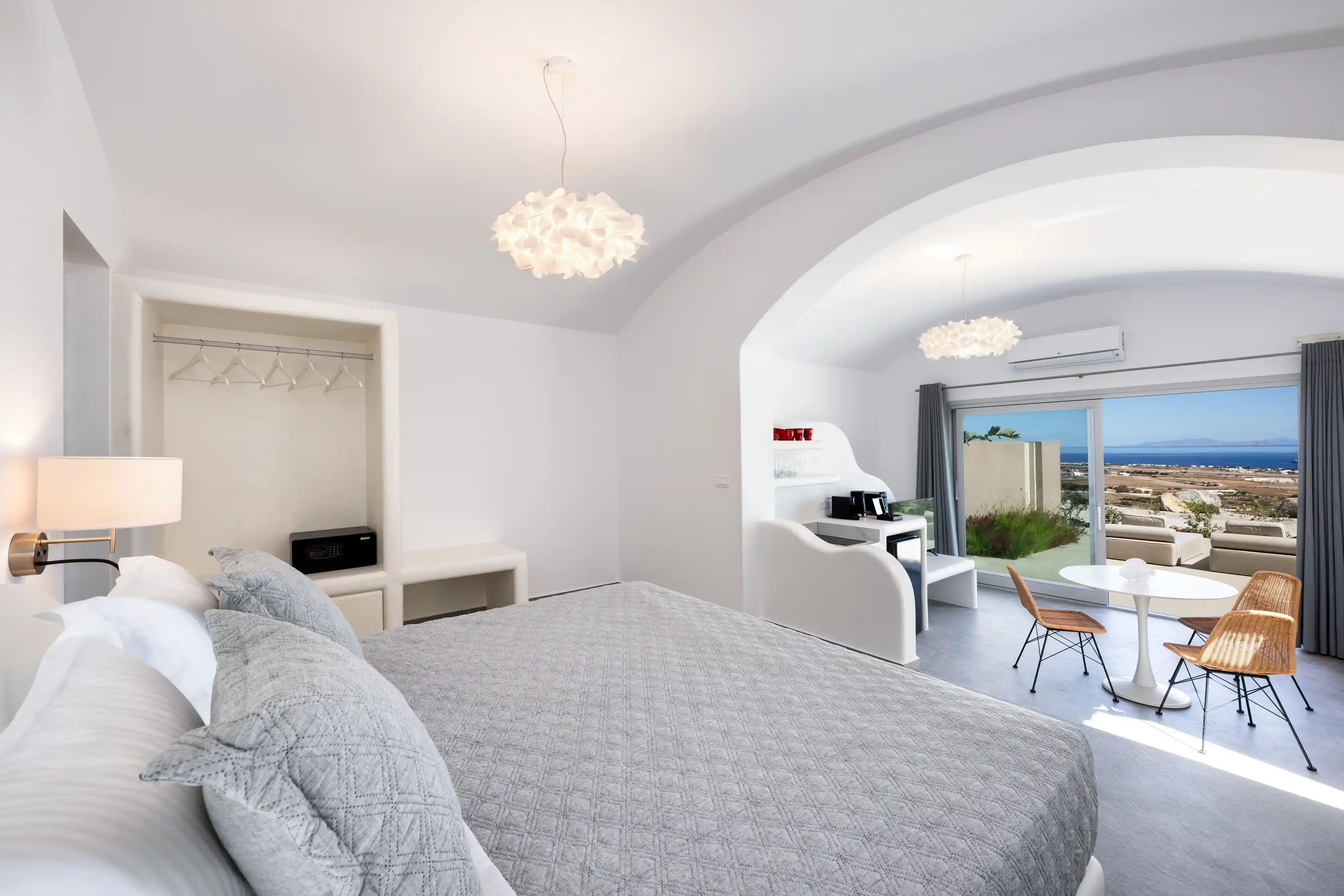 Superior Cave Villa bedroom with luxury relaxation area - Comfortable sleeping space with sun loungers