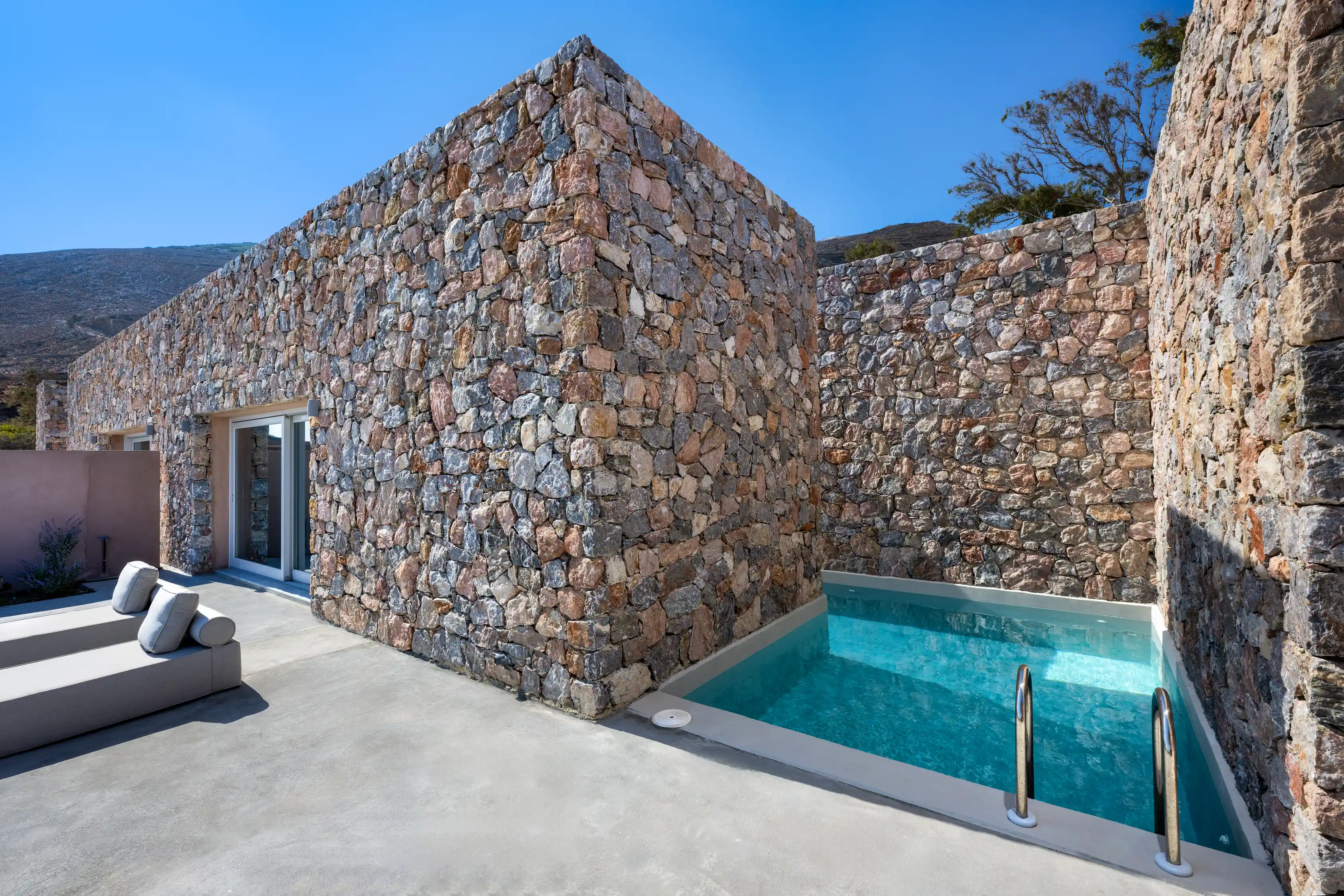 Private pool and stone architecture of Felicity Cave Villas in Santorini